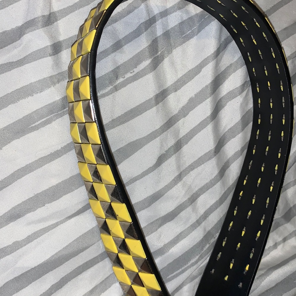 yellow and silver studded belt